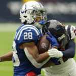 
              Indianapolis Colts running back Jonathan Taylor (28) gets hit by Houston Texans cornerback Steven Nelson (21) after a catch during the second half of an NFL football game Sunday, Sept. 11, 2022, in Houston. (AP Photo/David J. Phillip)
            