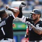 
              Chicago White Sox's Yoan Moncada (10) celebrates with Elvis Andrus after hitting a solo home run off Cleveland Guardians starting pitcher Hunter Gaddis during the third inning of a baseball game, Thursday, Sept. 15, 2022, in Cleveland. (AP Photo/Ron Schwane)
            