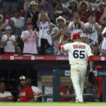 
              Los Angeles Angels relief pitcher Jose Quijada (65) signals to the crowd after leaving the mound during the tenth inning of a baseball game Saturday, Sept. 3, 2022, in Anaheim, Calif. The Angels won 2-1. (AP Photo/Raul Romero Jr.)
            