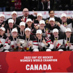 
              Canadian team poses with their gold medals after The IIHF World Championship Woman's ice hockey gold medal match between USA and Canada in Herning, Denmark, Sunday, Sept. 4, 2022.  (Bo Amstrup/Ritzau Scanpix via AP)
            