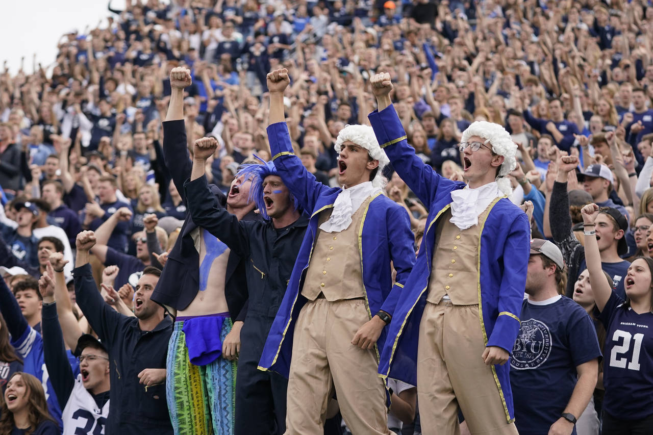 FILE - BYU fans celebrates after their team scores against Idaho State in the first half during an ...