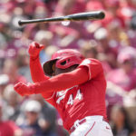 
              Cincinnati Reds' Aristides Aquino (44) has his bat slip out of his hands during the second inning of a baseball game against the Milwaukee Brewers, Sunday, Sept. 25, 2022, in Cincinnati. (AP Photo/Jeff Dean)
            