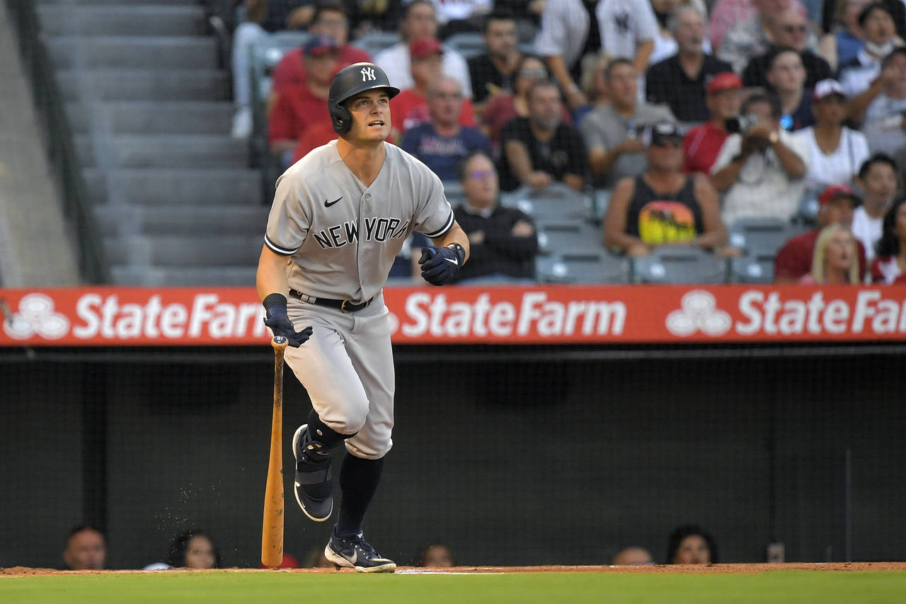 New York Yankees' Andrew Benintendi heads to first as he hits a solo home run during the first inni...