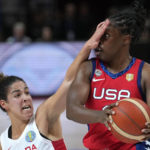 
              Canada's Kia Nurse, left, covers the face of United States' Chelsea Gray during their semifinal game at the women's Basketball World Cup in Sydney, Australia, Friday, Sept. 30, 2022. (AP Photo/Rick Rycroft)
            