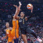 
              Las Vegas Aces forward A'ja Wilson (22) posts up for a shot over Connecticut Sun center Brionna Jones during the first half in Game 1 of a WNBA basketball final playoff series Sunday, Sept. 11, 2022, in Las Vegas. (AP Photo/L.E. Baskow)
            