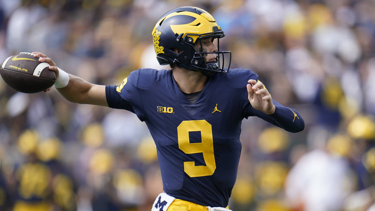 Michigan quarterback J.J. McCarthy throws against Connecticut in the second half of an NCAA college...