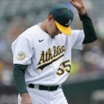 
              Oakland Athletics pitcher Adrian Martinez walks to the dugout after being relieved during the fourth inning of a baseball game against the Chicago White Sox in Oakland, Calif., Saturday, Sept. 10, 2022. (AP Photo/Jeff Chiu)
            