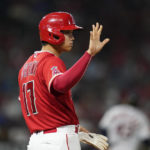 
              Los Angeles Angels designated hitter Shohei Ohtani waves at first base during the fifth inning of a baseball game against the Houston Astros in Anaheim, Calif., Friday, Sept. 2, 2022. (AP Photo/Ashley Landis)
            