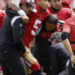 
              San Francisco 49ers quarterback Trey Lance (5) is helped onto a cart during the first half of an NFL football game against the Seattle Seahawks in Santa Clara, Calif., Sunday, Sept. 18, 2022. (AP Photo/Josie Lepe)
            