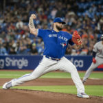 
              Toronto Blue Jays starting pitcher Alek Manoah throws during the first inning of the team's baseball game against the Boston Red Sox on Friday, Sept. 30, 2022, in Toronto. (Christopher Katsarov/The Canadian Press via AP)
            