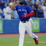 
              Toronto Blue Jays' Vladimir Guerrero Jr. celebrates his solo home run against the Tampa Bay Rays during the first  inning of a baseball game Wednesday, Sept. 14, 2022, in Toronto. (Frank Gunn/The Canadian Press via AP)
            