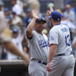 
              Los Angeles Dodgers manager Dave Roberts, left, congratulates Max Muncy after the team defeated the San Diego Padres in a baseball game, Sunday, Sept. 11, 2022, in San Diego. (AP Photo/Derrick Tuskan)
            