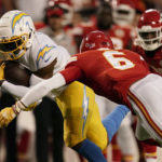 
              Los Angeles Chargers tight end Gerald Everett runs with the ball as Kansas City Chiefs safety Bryan Cook (6) defends during the first half of an NFL football game Thursday, Sept. 15, 2022, in Kansas City, Mo. (AP Photo/Charlie Riedel)
            