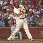 
              St. Louis Cardinals' Yadier Molina hits a three-run double during the third inning of the team's baseball game against the Chicago Cubs on Saturday, Sept. 3, 2022, in St. Louis. (AP Photo/Joe Puetz)
            