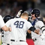 
              New York Yankees' Josh Donaldson celebrates with teammates after hitting a walk-off RBI single during the tenth inning of a baseball game against the Boston Red Sox Thursday, Sept. 22, 2022, in New York. The Yankees won 5-4. (AP Photo/Frank Franklin II)
            