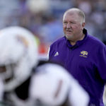 
              Tennessee Tech head coach Dewayne Alexander watches warmups before an NCAA college football game against Kansas Friday, Sept. 2, 2022, in Lawrence, Kan. (AP Photo/Charlie Riedel)
            