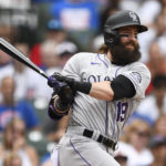 
              Colorado Rockies' Charlie Blackmon (19) watches his RBI-riple during the ninth inning of a baseball game against the Chicago Cubs, Saturday, Sept. 17, 2022, in Chicago. (AP Photo/Paul Beaty)
            