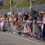 
              Fans wait for the riders to arrive at at the Zandvoort racetrack, Netherlands, Friday, Sept. 2, 2022, ahead of Sunday's Formula One Dutch Grand Prix auto race. (AP Photo/Peter Dejong)
            
