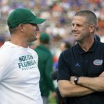 
              South Florida head coach Jeff Scott, left, and Florida head coach Billy Napier greet each other at midfield before an NCAA college football game, Saturday, Sept. 17, 2022, in Gainesville, Fla. (AP Photo/John Raoux)
            