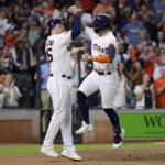 
              Houston Astros Trey Mancini, left, and Chas McCormick celebrate after they both score on the two run home run by McCormick during the fifth inning of a baseball game against the Arizona Diamondbacks Wednesday, Sept. 28, 2022, in Houston. (AP Photo/Michael Wyke)
            
