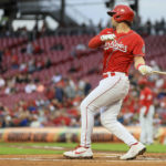 
              CORRECTS TO FIRST INNING NOT SECOND INNING - Cincinnati Reds' Kyle Farmer watches his two-run double during the first inning of a baseball game against the Milwaukee Brewers in Cincinnati, Friday, Sept. 23, 2022. (AP Photo/Aaron Doster)
            
