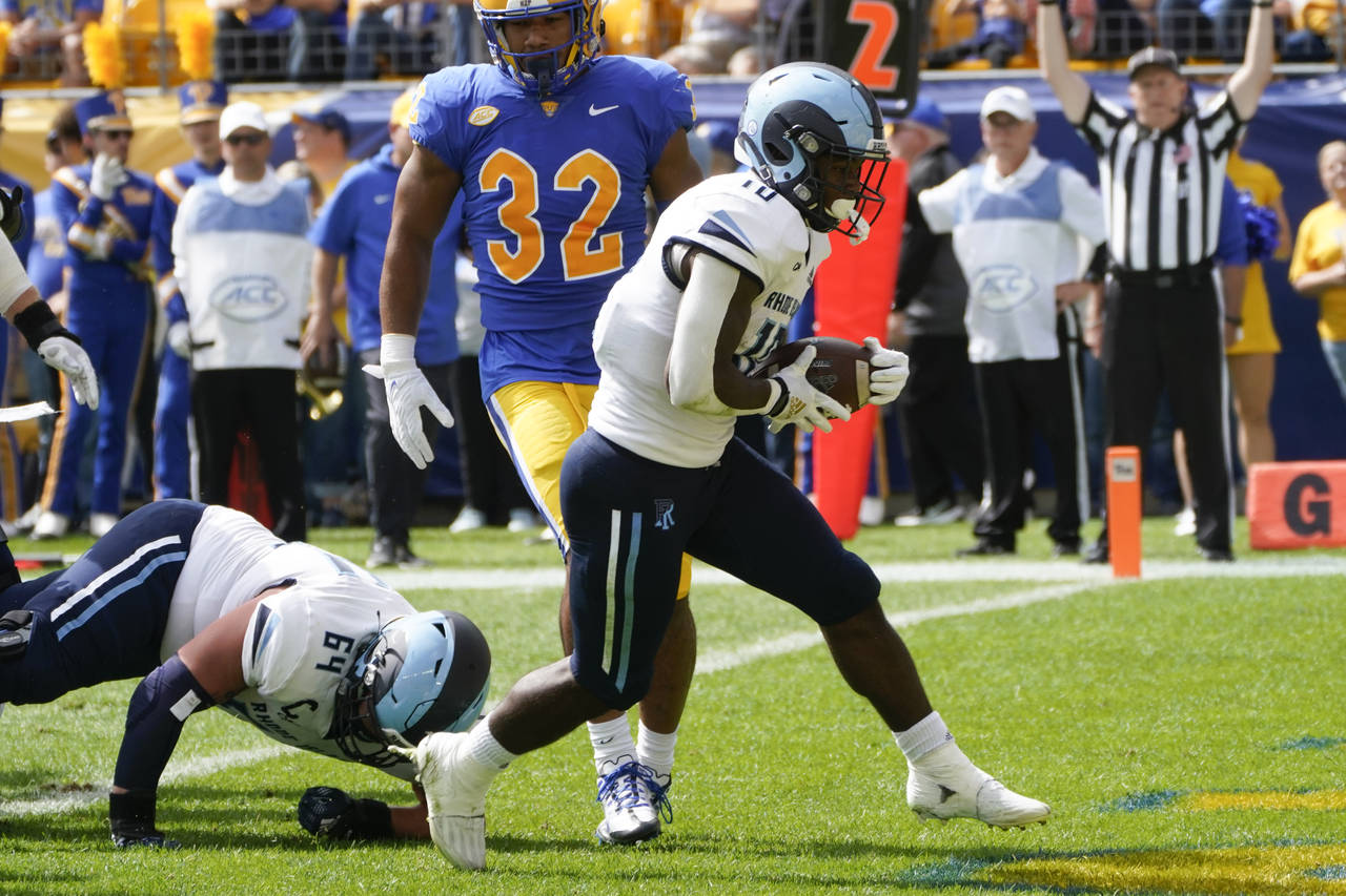 Rhode Island running back Marques DeShields (10) takes a handoff into the end zone for a touchdown ...