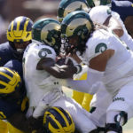 
              Colorado State wide receiver Melquan Stovall is tackled by the Michigan defense during the first half of an NCAA college football game, Saturday, Sept. 3, 2022, in Ann Arbor, Mich. (AP Photo/Carlos Osorio)
            