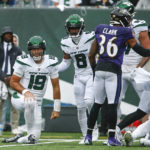 
              New York Jets' Elijah Moore (8) helps up quarterback Joe Flacco (19) after Flacco threw an interception during the first half of an NFL football game against the Baltimore Ravens, Sunday, Sept. 11, 2022, in East Rutherford, N.J. (AP Photo/John Munson)
            