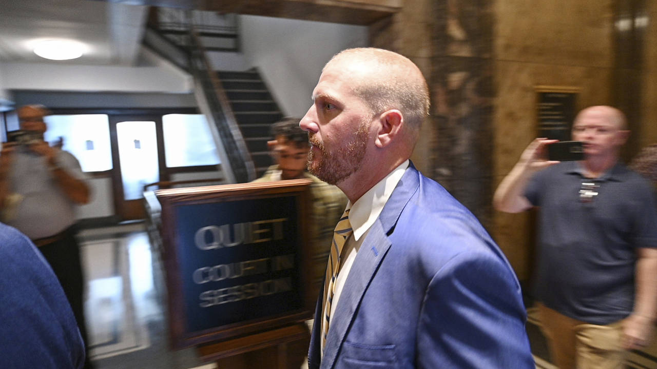 Former Kansas City Chiefs assistant coach Britt Reid walks to a courtroom at the Jackson County Cou...