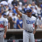 
              Los Angeles Dodgers manager Dave Roberts gestures to the crowd after the team defeated the San Diego Padres in a baseball game, Sunday, Sept. 11, 2022, in San Diego. (AP Photo/Derrick Tuskan)
            