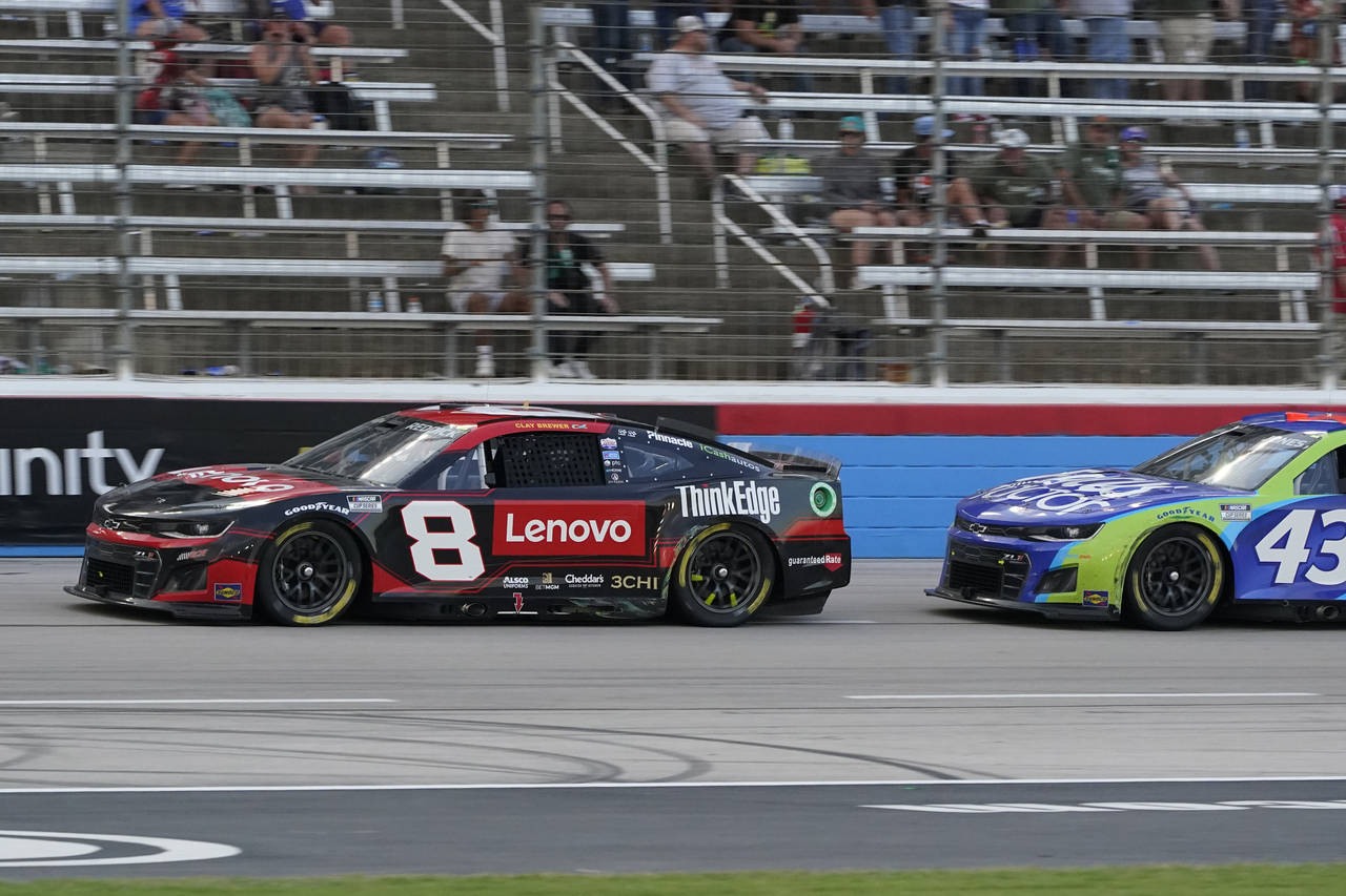 Tyler Reddick drives in front of Erik Jones (43) during the NASCAR Cup Series auto race at Texas Mo...