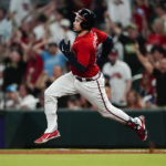 
              Atlanta Braves' Travis d'Arnaud runs the bases after hitting a two-run home run in the fourth inning of a baseball game against the Miami Marlins, Friday, Sept. 2, 2022, in Atlanta. (AP Photo/John Bazemore)
            