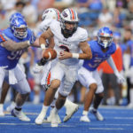 
              Tennessee-Martin quarterback Dresser Winn (3) turns to hand off the ball against Boise State in the second half of an NCAA college football game, Saturday, Sept. 17, 2022, in Boise, Idaho. (AP Photo/Steve Conner)
            