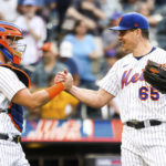 
              New York Mets' relief pitcher Trevor May shakes hands with catcher Tomas Nido after they defeated the Pittsburgh Pirates in a baseball game, Sunday, Sept. 18, 2022, in New York. (AP Photo/Julia Nikhinson)
            