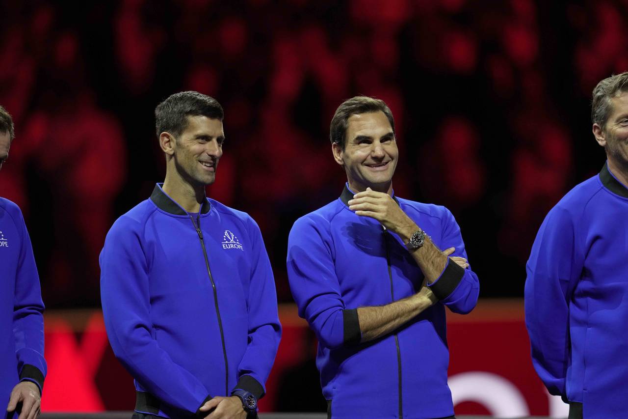 Team Europe's Novak Djokovic and Roger Federer stand side by side at the end of the Laver Cup tenni...