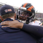 
              Chicago Bears quarterback Justin Fields, right, hugs coach Matt Eberflus after an NFL football game against the Houston Texans Sunday, Sept. 25, 2022, in Chicago. The Bears won 23-20. (AP Photo/Nam Y. Huh)
            