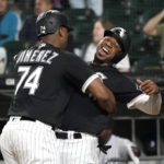 
              Chicago White Sox's Eloy Jimenez (74) celebrates his three-run home run off Colorado Rockies starting pitcher Chad Kuhl with Elvis Andrus during the first inning of a baseball game Tuesday, Sept. 13, 2022, in Chicago. (AP Photo/Charles Rex Arbogast)
            