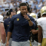 
              Notre Dame head coach Marcus Freeman acknowledges the players after the team scored a touchdown during the first half of an NCAA college football game against North Carolina in Chapel Hill, N.C., Saturday, Sept. 24, 2022 (AP Photo/Chris Seward)
            