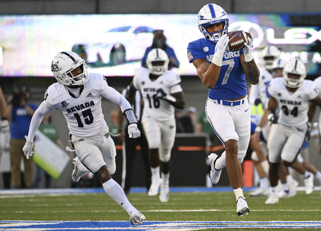 Air Force wide receiver David Cormier (7) catches a pass from quarterback Ben Brittain (not shown) ...