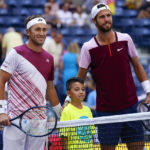 
              Casper Ruud, of Norway, left, and Karen Khachanov, of Russia, pose of a photo before playing in the semifinals of the U.S. Open tennis championships, Friday, Sept. 9, 2022, in New York. (AP Photo/Matt Rourke)
            