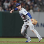 
              Los Angeles Dodgers shortstop Trea Turner throws out San Francisco Giants' Heliot Ramos at first base during the fifth inning of a baseball game in San Francisco, Saturday, Sept. 17, 2022. (AP Photo/Jeff Chiu)
            