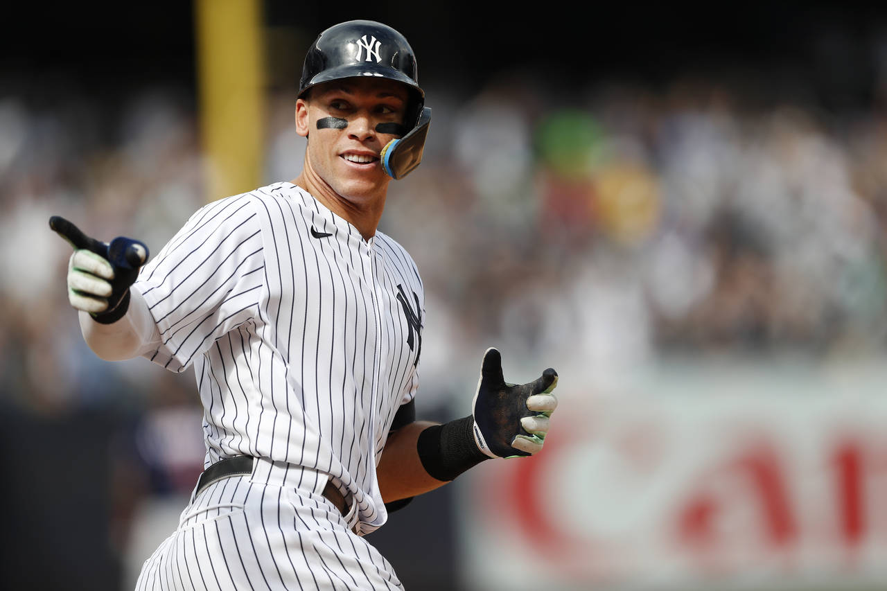 New York Yankees right fielder Aaron Judge (99) reacts while rounding the bases after hitting a hom...