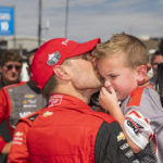 
              Team Penske driver Will Power, of Australia kisses, his son after winning the championship after the IndyCar season finale auto race at Laguna Seca Raceway on Sunday, Sept. 11, 2022, Monterey, Calif. (AP Photo/Nic Coury)
            
