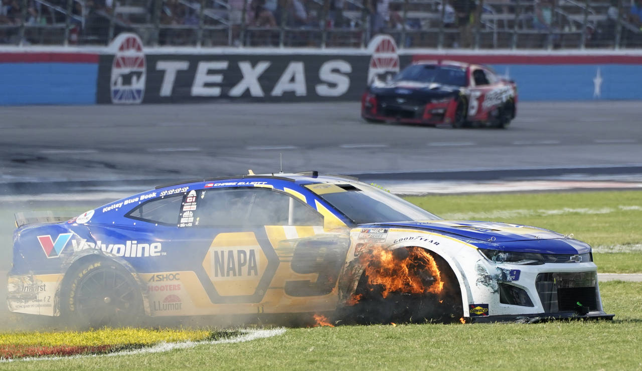 Chase Elliott's tire burns after he contacted the wall during the NASCAR Cup Series auto race at Te...