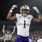 
              Washington wide receiver Rome Odunze (1) celebrates his touchdown catch against UCLA during the first half of an NCAA college football game Friday, Sept. 30, 2022, in Pasadena, Calif. (AP Photo/Marcio Jose Sanchez)
            