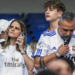 
              Maria Garcia-Mella Cid and his son Alejandro inside the Santiago Bernabeu stadium after a Spanish La Liga soccer match between Real Madrid and Betis in Madrid, Spain, Saturday, Sept. 3, 2022. "Everything was perfect, absolutely perfect," she said after Madrid's 2-1 win over Real Betis on Saturday. "It was awesome to see them win and for my son Alejandro to see them win," she said, breaking down in tears while giving her 13-year-old son a warm hug outside the Bernabeu. One of Real Madrid’s most hardcore fans, Garcia-Mella has returned to Spain to be near the club she adores after spending two decades in the United States building a family and a career. (AP Photo/Pablo Garcia, File)
            