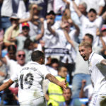 
              Real Madrid's Federico Valverde, right, celebrates with Real Madrid's Dani Ceballos after scoring his side's first goal during the Spanish La Liga soccer match between Real Madrid and Mallorca at the Santiago Bernabeu stadium in Madrid, Spain, Sunday, Sept. 11, 2022. (AP Photo/Manu Fernandez)
            