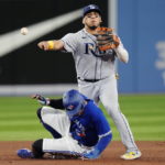 
              Tampa Bay Rays second baseman Isaac Paredes throws to first base after forcing out Toronto Blue Jays' George Springer during the third inning of a baseball game Wednesday, Sept. 14, 2022, in Toronto. Vladimir Guerrero was safe at first. (Frank Gunn/The Canadian Press via AP)
            
