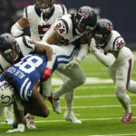 
              Indianapolis Colts tight end Mo Alie-Cox (81) hangs onto a pass as Houston Texans linebacker Kamu Grugier-Hill (51) teammate cornerback Derek Stingley Jr. (24) and cornerback Desmond King II (25) make the stop uring the second half of an NFL football game Sunday, Sept. 11, 2022, in Houston. (AP Photo/David J. Phillip)
            