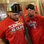 
              St. Louis Cardinals catcher Yadier Molina, left, and first base coach Stubby Clapp celebrate after defeating the Milwaukee Brewers in a baseball game to win the National League Central title Tuesday, Sept. 27, 2022, in Milwaukee. (AP Photo/Morry Gash)
            